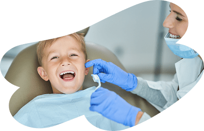 Vector-2 Happy toddler during his child's first dentist visit in Ramsey NJ