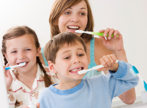 Cavity Prevention Treatments for Children in Ramsey, NJ family brushing teeth to avoid cavity prevention treatment